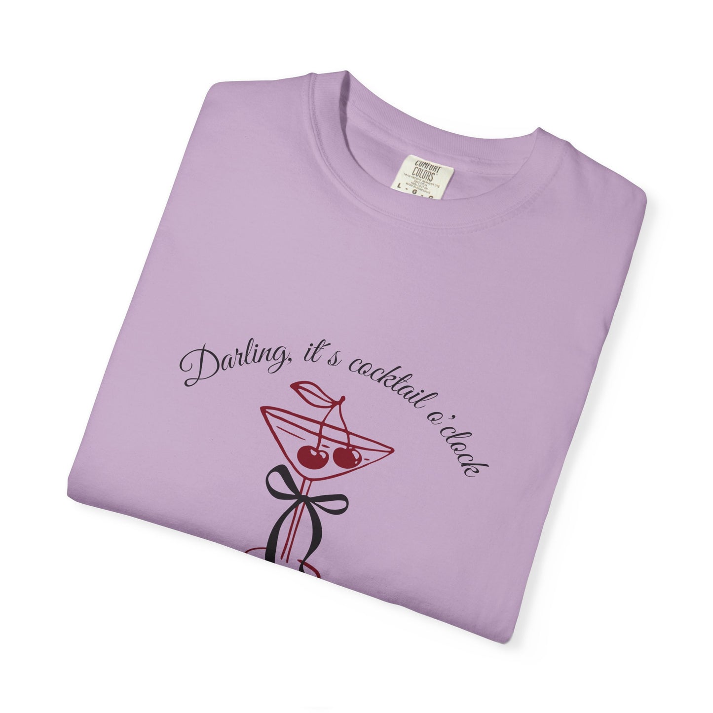 Folded purple t-shirt with cocktail graphic and text on a white background