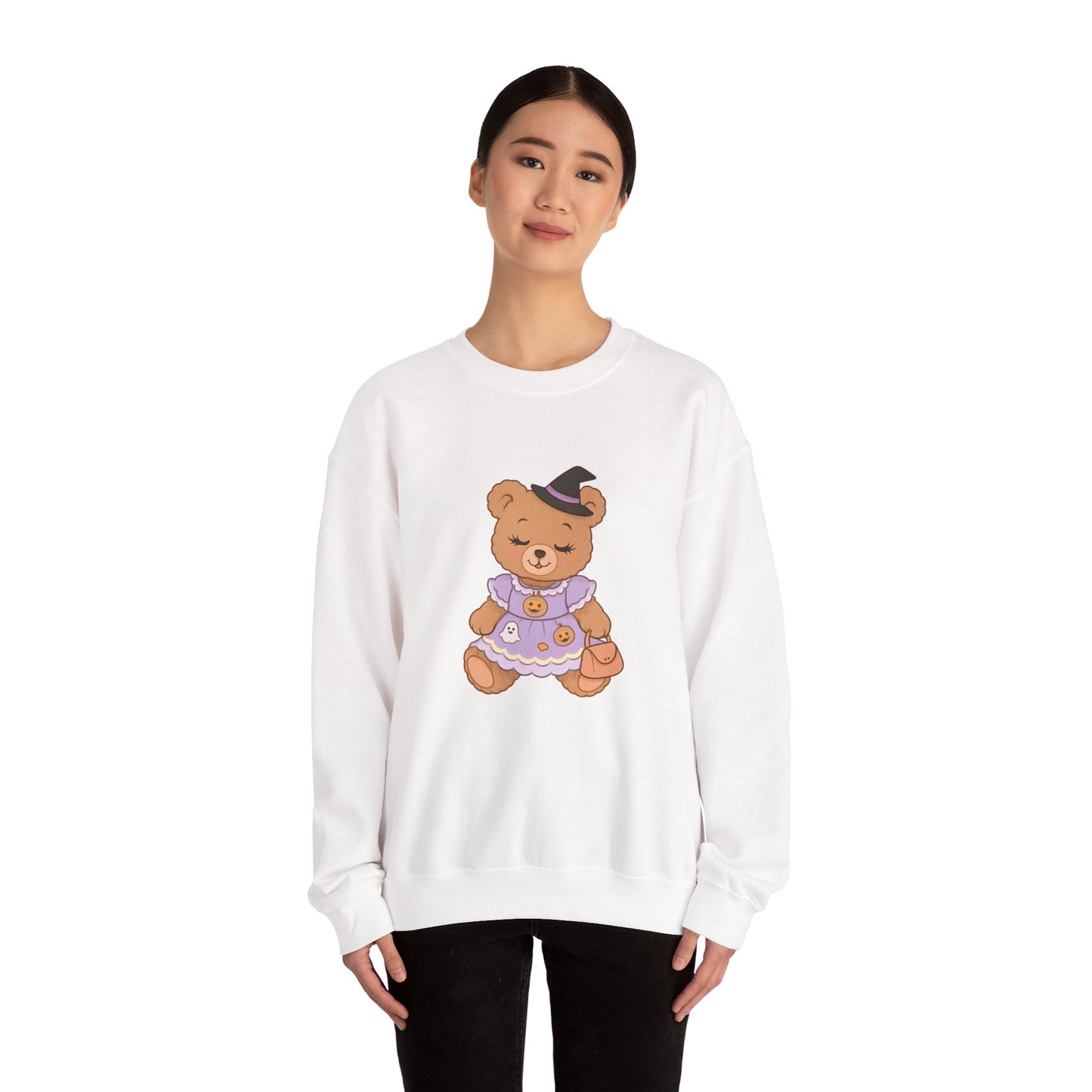Person wearing a white sweatshirt with a teddy bear graphic on a white background