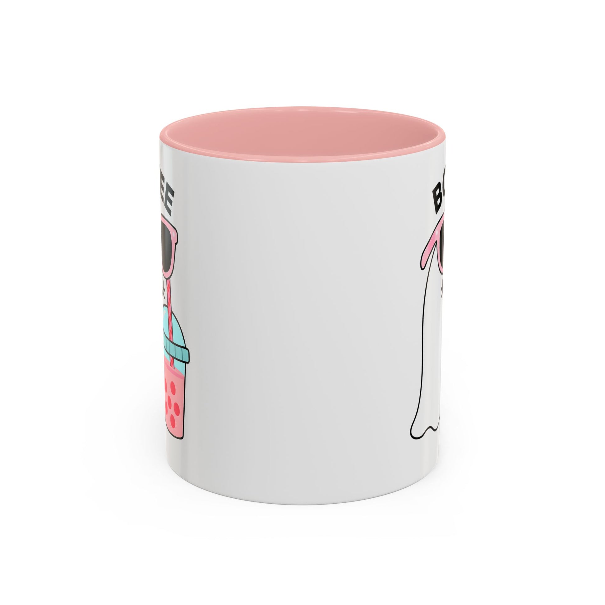 White mug with pink interior and cartoon character design on a white background