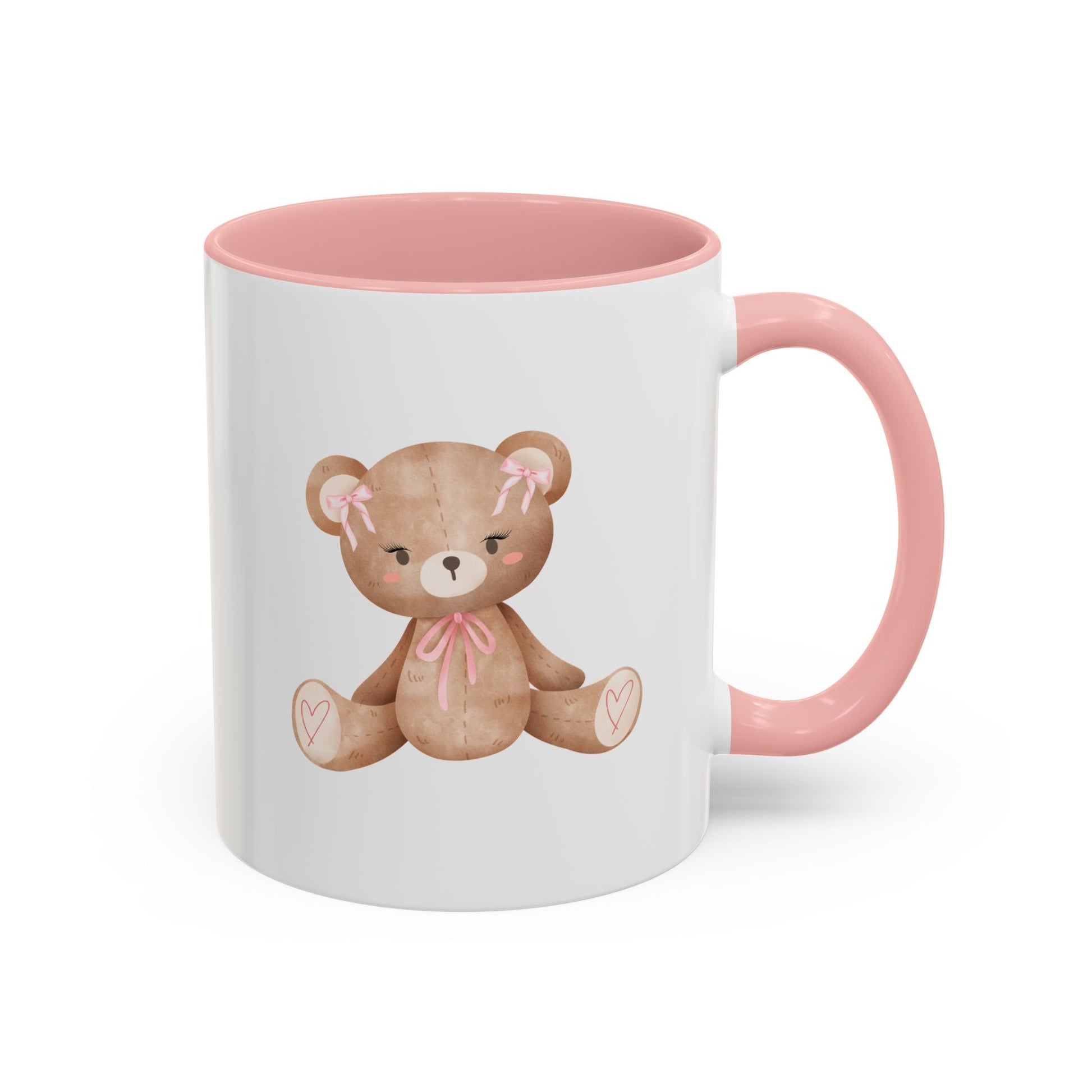 White mug with pink interior and handle featuring a teddy bear design on a white background