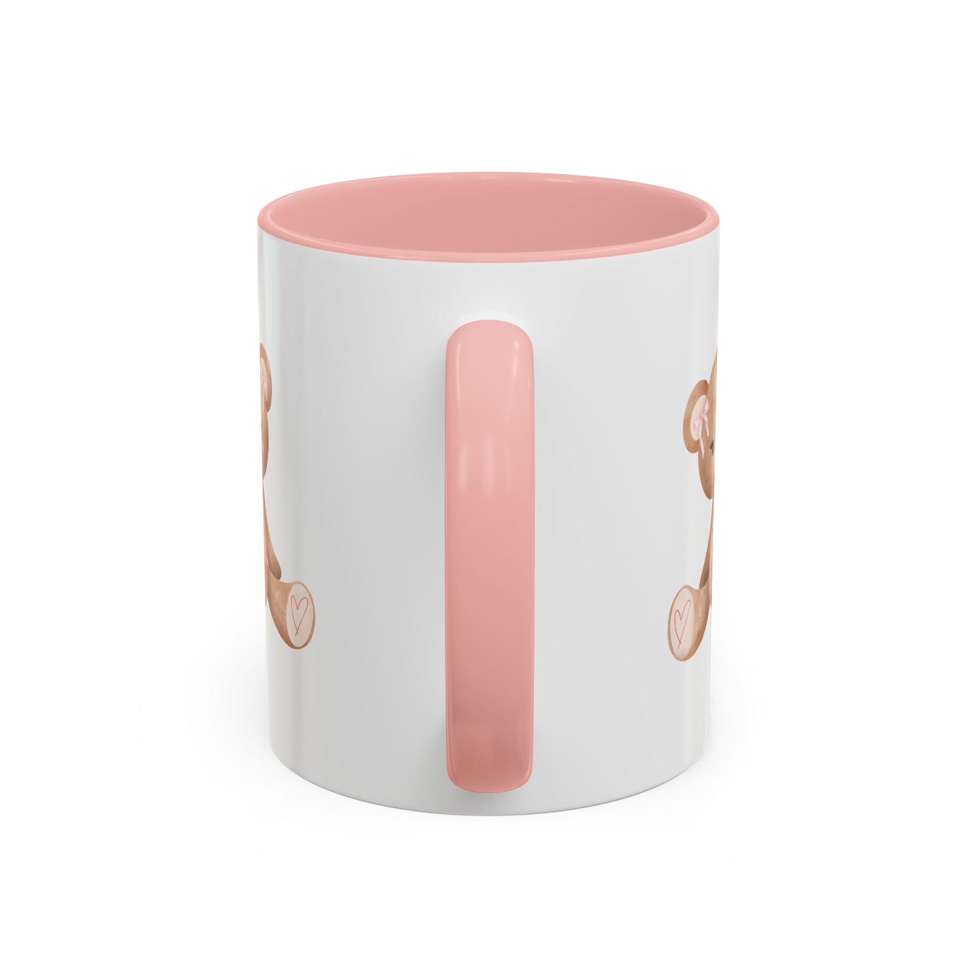 White mug with pink handle and interior, featuring a design on a white background