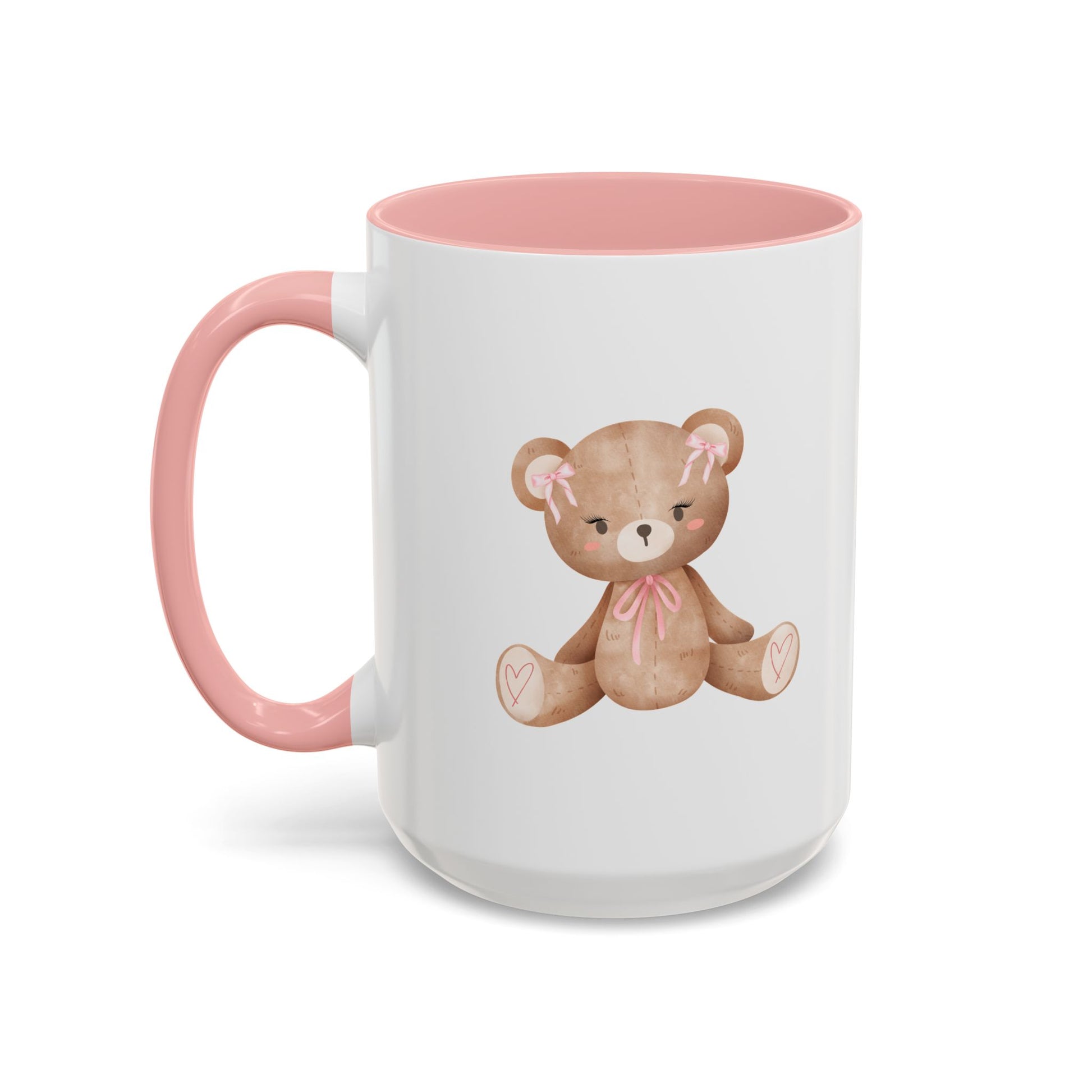 White mug with pink interior and handle, featuring a teddy bear design on a white background